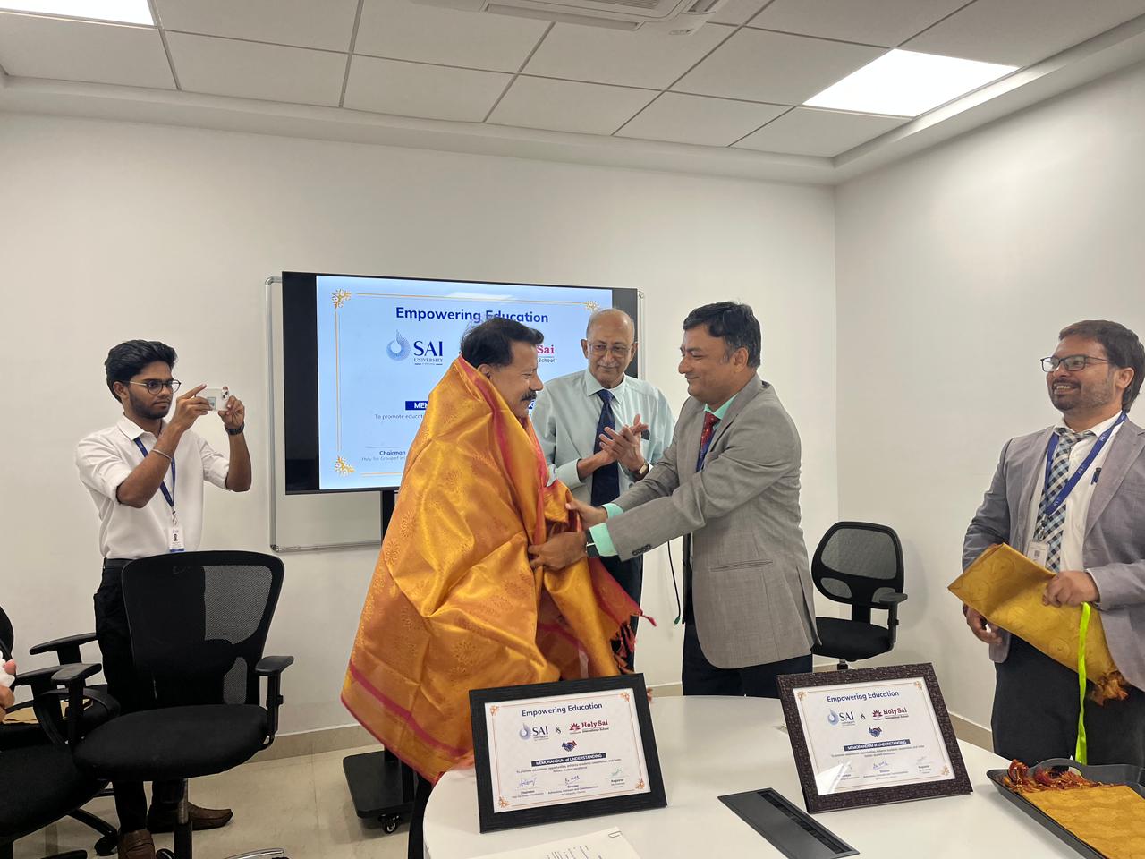Signing of MoU with Sai University in the presence of Mr. Ramani, Chancellor & Dr. Vivek Shivhare, Founding Director-Admissions